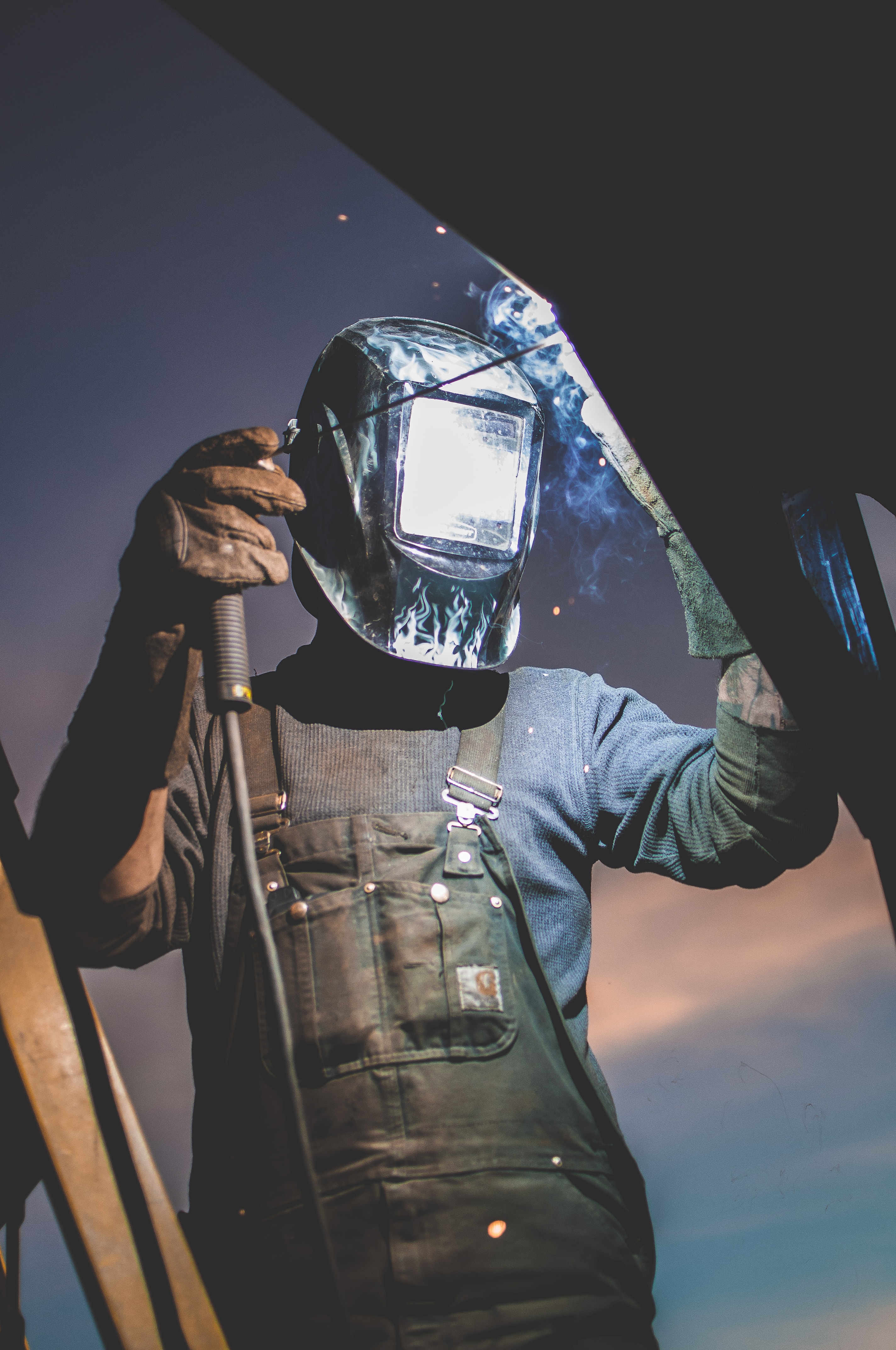 man welding needs machine guarding