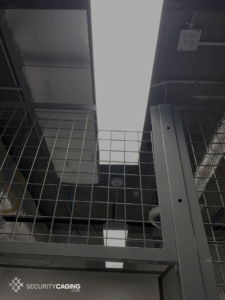 Wire mesh enclosure with field cut for lighting