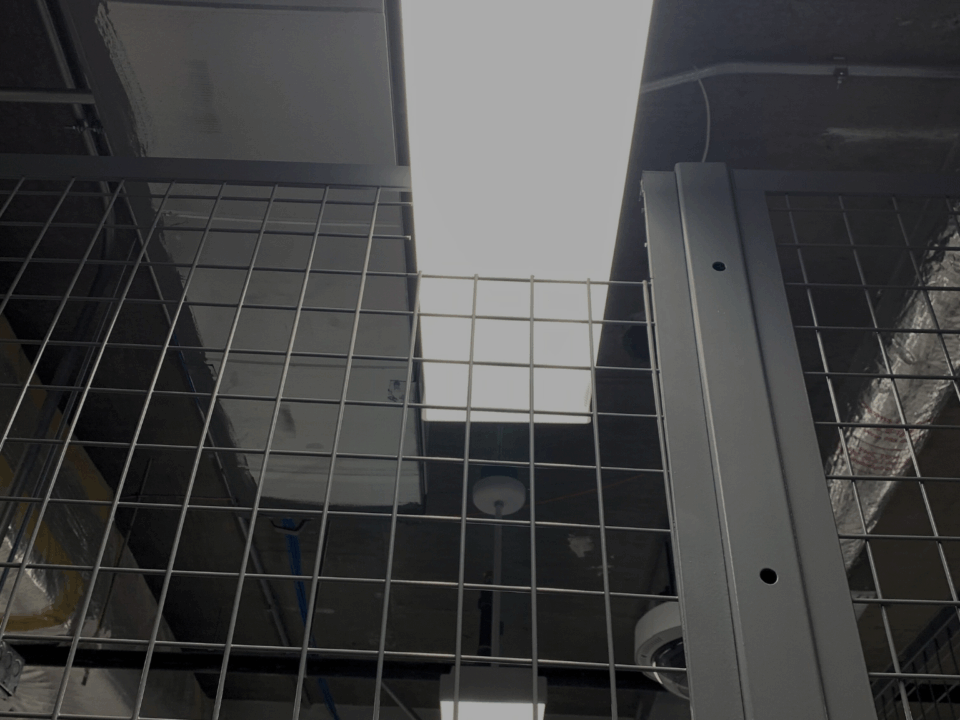 Wire mesh enclosure with field cut for lighting